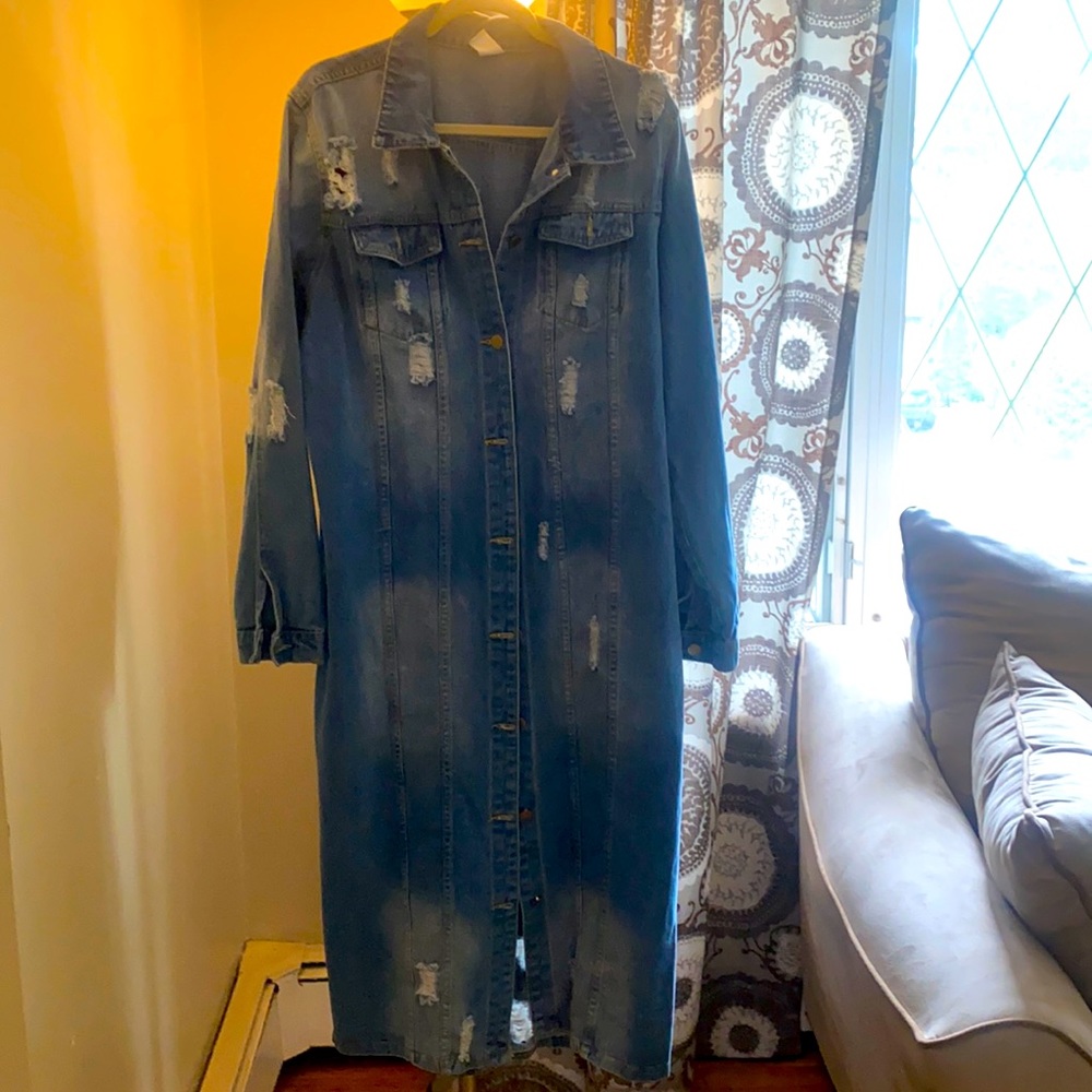 Long distressed denim jacket.